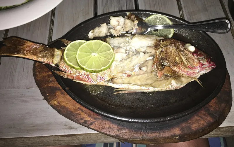 Fried red snapper with limes at a restaurant in Tamarindo