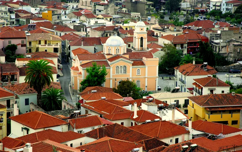 Tiled roofs of Kalamata's old town with the Ypapanti cathedral