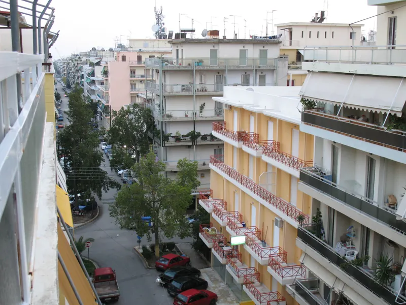 Residential street in Kalamata with typical apartment buildings and balconies