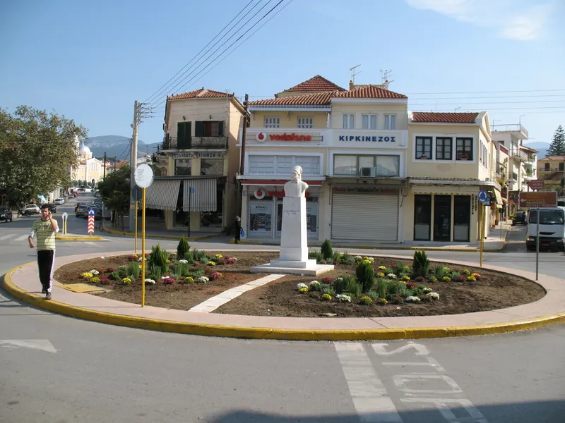 Roundabout on 23rd March Square in Kalamata with residential and commercial buildings