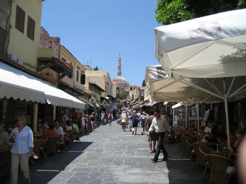 Sokratous shopping street in Rhodes Town's old town with cafés and passers-by
