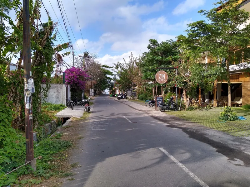 Jalan Nelayan in Canggu with a café and parked scooters