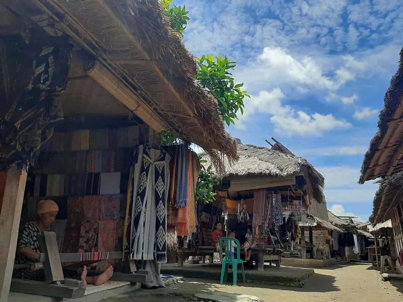 Lane in the Sasak village of Sade on Lombok with stalls selling woven goods