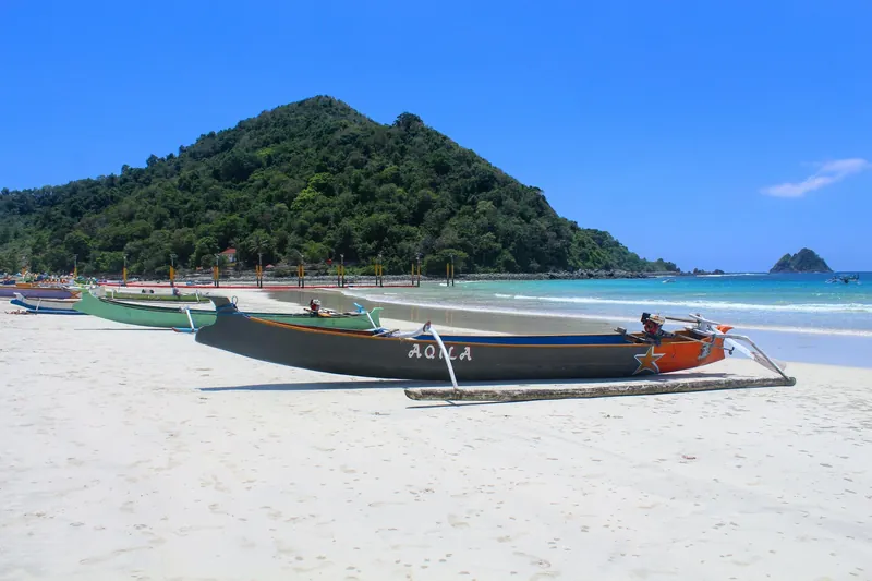 Fishing boats on the white sand beach at Selong Belanak in south Lombok