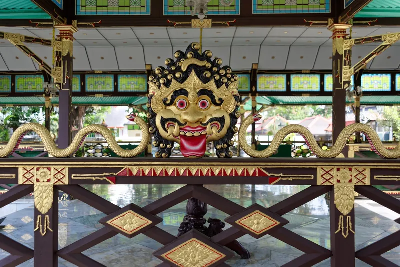 Gilded Kala mask on a pavilion in the Kraton Ngayogyakarta Hadiningrat, the Sultan's Palace in Yogyakarta