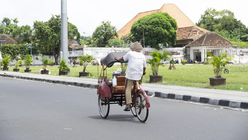 Cycle rickshaw (becak) on a street in Yogyakarta