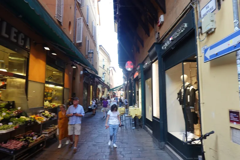 Shopping street with food shops in Bologna's old town