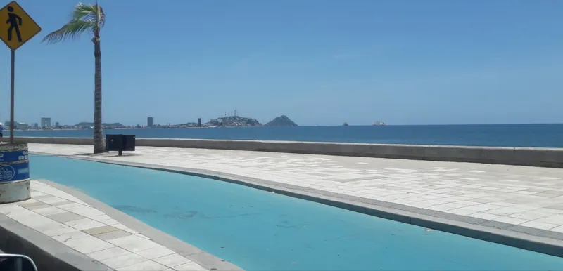 Malecón waterfront promenade in Mazatlán, looking towards Cerro del Crestón and its lighthouse