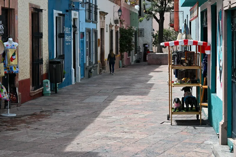 Street stall and shops in a pedestrian lane of Querétaro's historic centre
