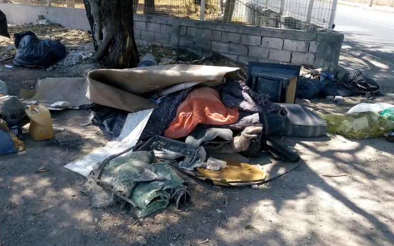 Illegally dumped household waste, including old textiles, plastic canisters and a television, beside a street in the Los Girasoles neighbourhood of Querétaro in April 2020.