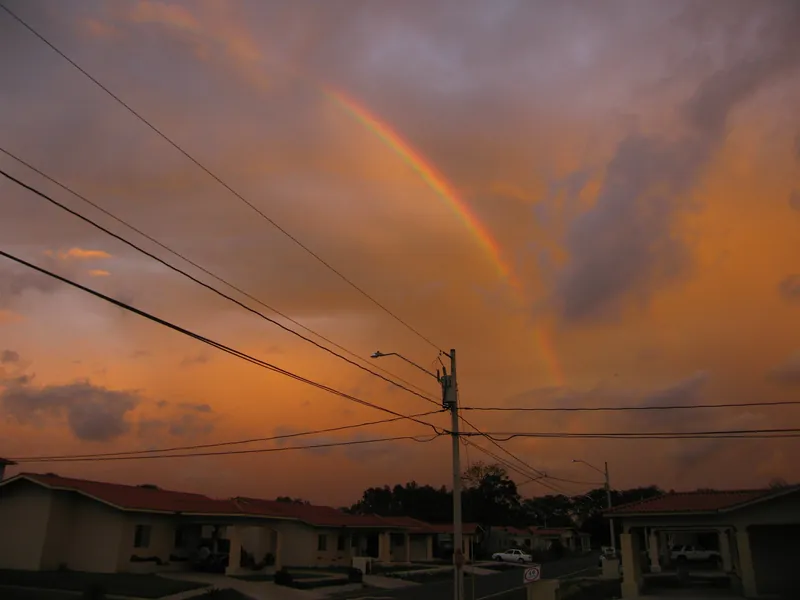 Rainbow over a neighbourhood of bungalows in David
