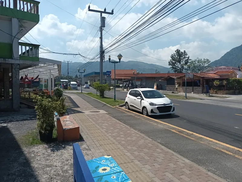Main street of El Valle de Antón with shops and mountains behind