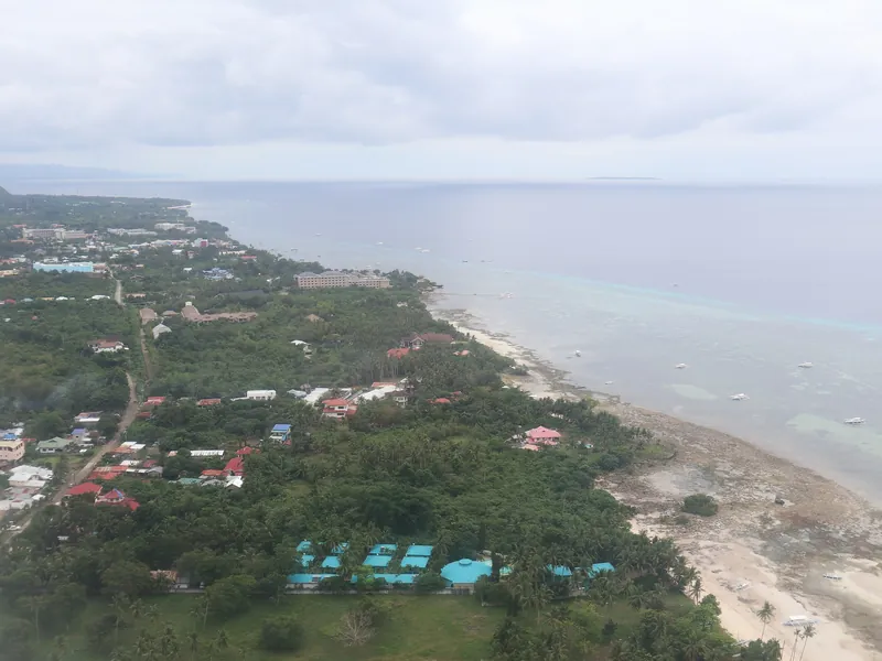 Aerial view of the Panglao coast with Alona Beach and resorts, Bohol