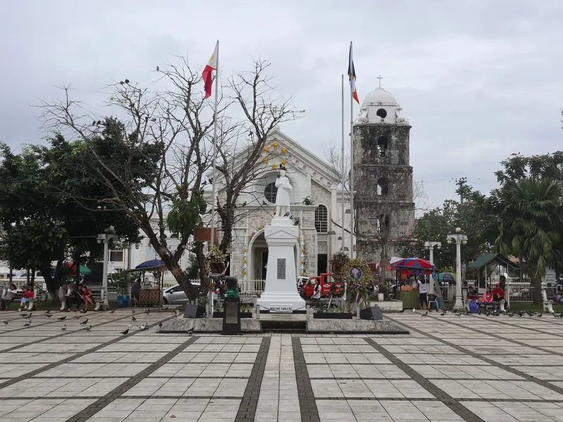 Plaza Rizal with St Joseph Cathedral and the old bell tower in Tagbilaran City, Bohol