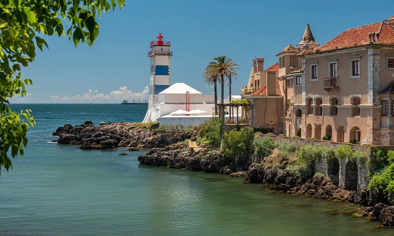 Santa Marta lighthouse and rocky coast in Cascais