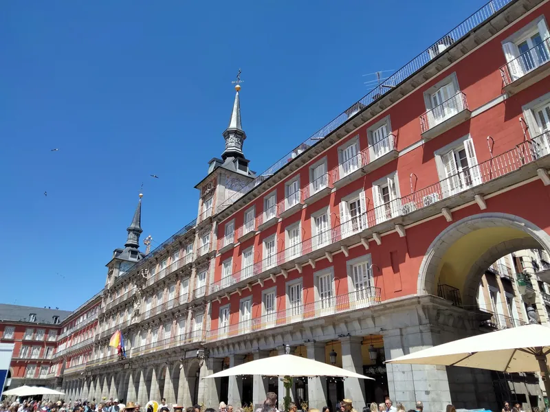 North side of Madrid's Plaza Mayor with the Casa de la Panadería and terraces under the arcades