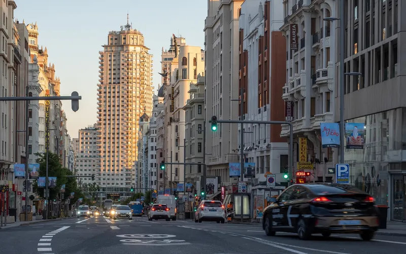Gran Vía in Madrid in morning light, with the Torre de Madrid on Plaza de España behind