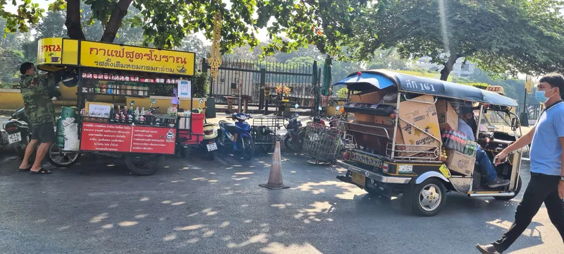 Delivery tuk-tuk and mobile coffee stall at the roadside in Chiang Mai